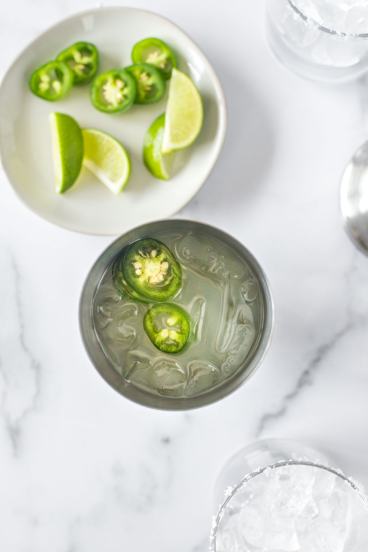 Close up of a jalapeno margarita in a rocks glass. 