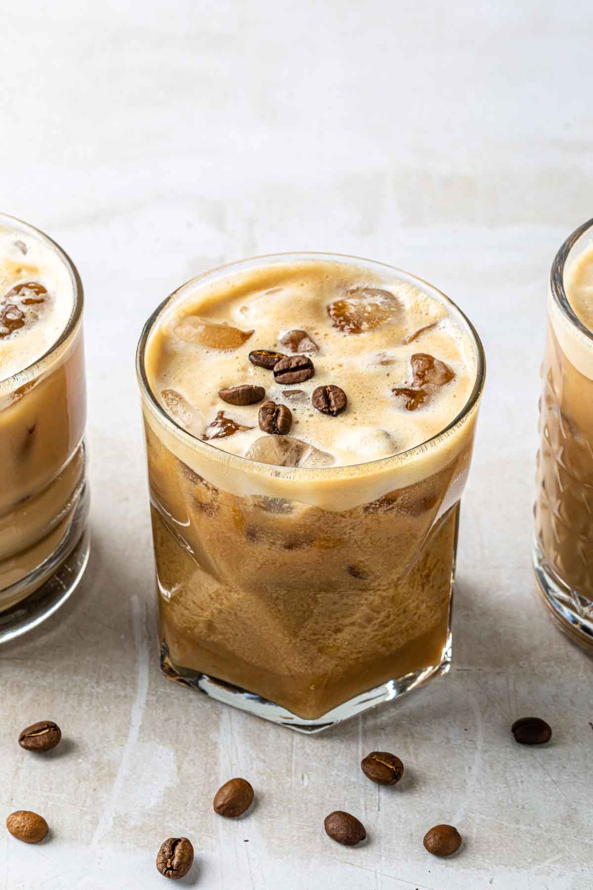Shaft drinks in old fashioned glasses, garnished with coffee beans. 