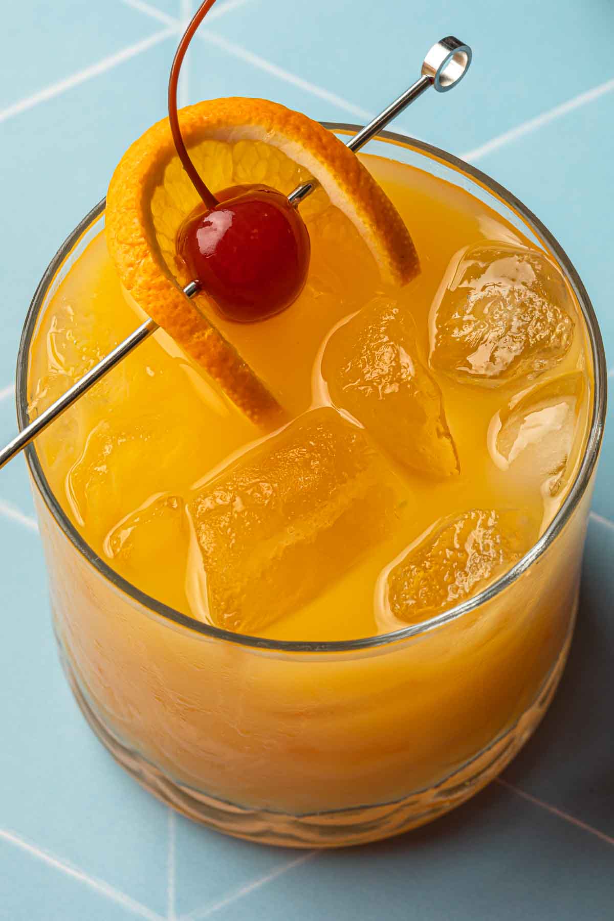 Close up overhead shot of a cocktail made with orange juice. 
